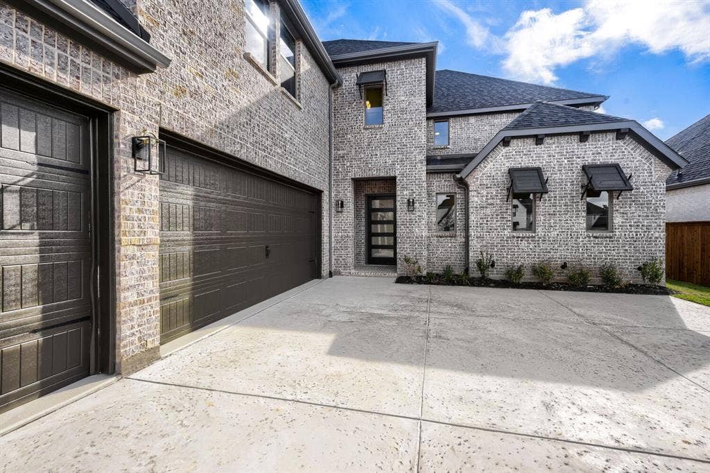 1317 Naples Court, Keller, TX 76248 Multi-car garage with dark paneled doors