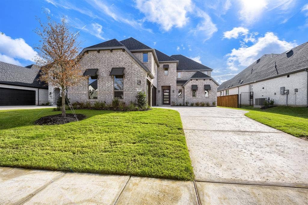 1317 Naples Court, Keller, TX 76248 Brick exterior with dark roof shingles, an attached garage, a contemporary front entry door, and a concrete driveway