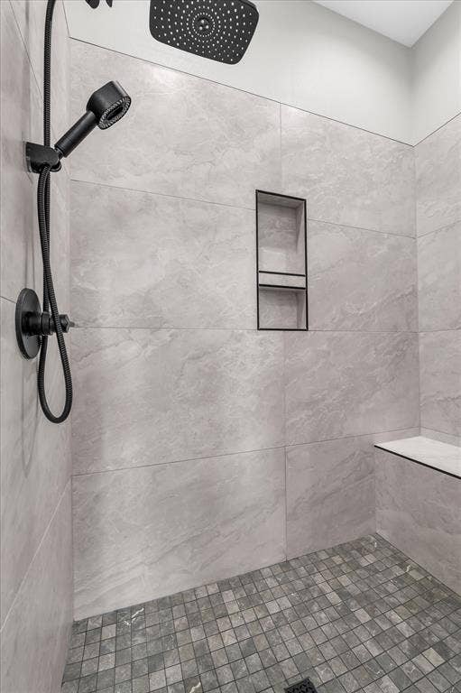 154 Water View Lane, Robinson, TX 76706 separate tiled shower with bench in primary bathroom