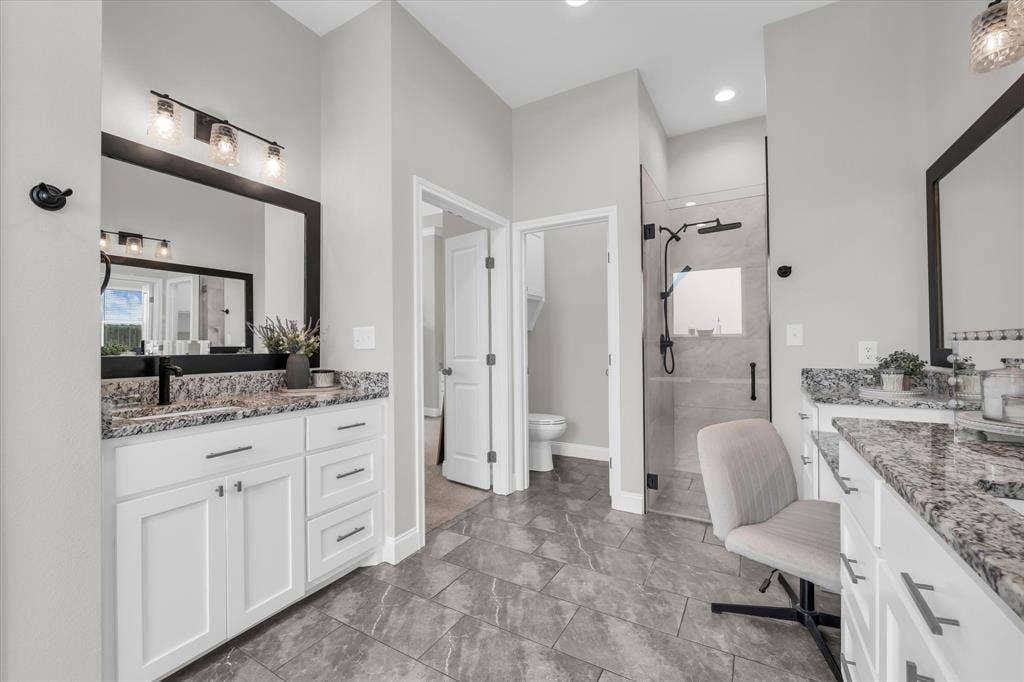 154 Water View Lane, Robinson, TX 76706 dual vanities in primary ensuite bathroom