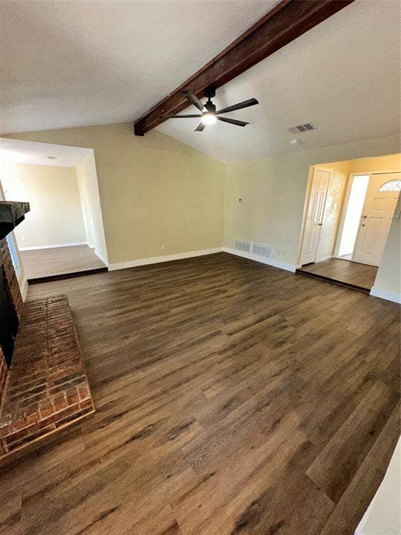 6620 Moss Lane, Watauga, TX 76148 Spacious living area featuring vaulted ceilings with an exposed wood beam, a ceiling fan, and wood-finish flooring