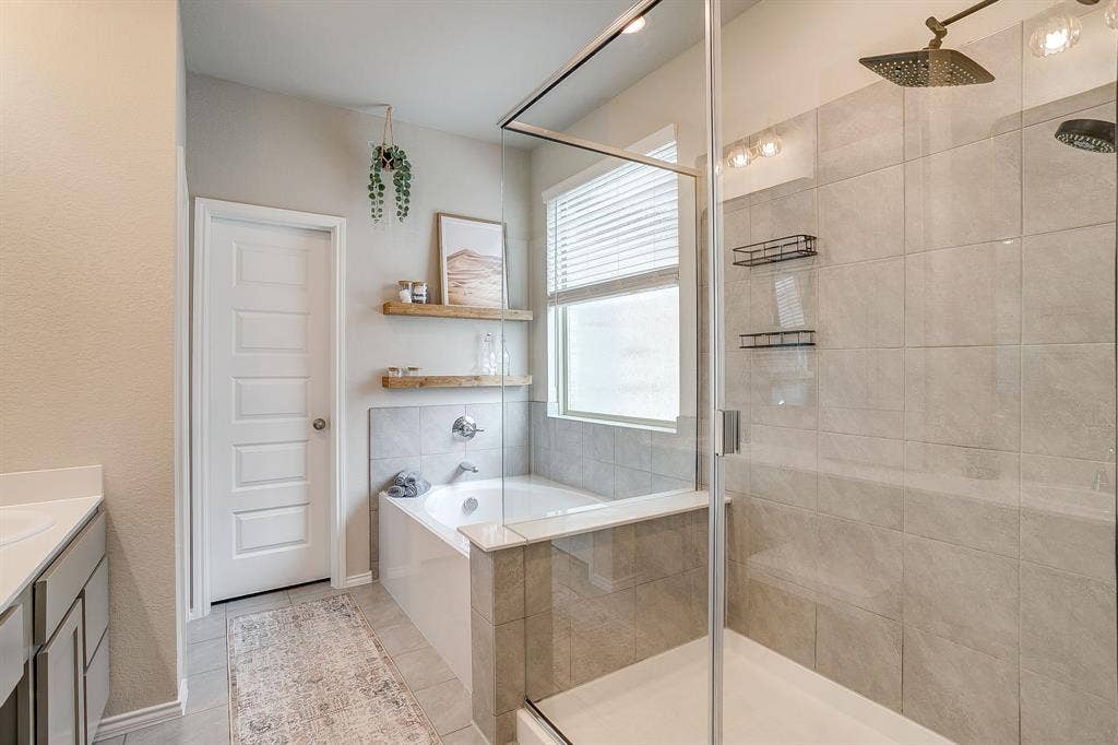 14124 Cassiopeia Drive, Haslet, TX 76052 Spa like bathroom with neutral finishes, large walk in shower and separate tub.