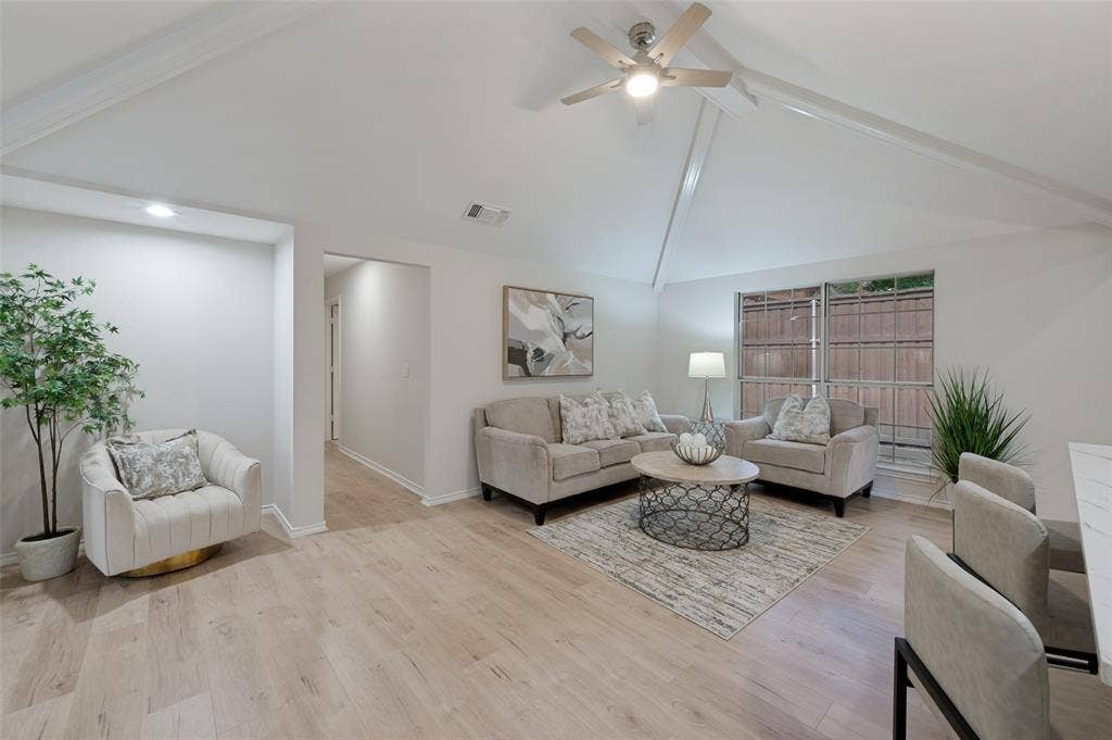 4420 Barwyn Lane, Plano, TX 75093 Living area featuring vaulted ceilings, wood-finish flooring, and a ceiling fan