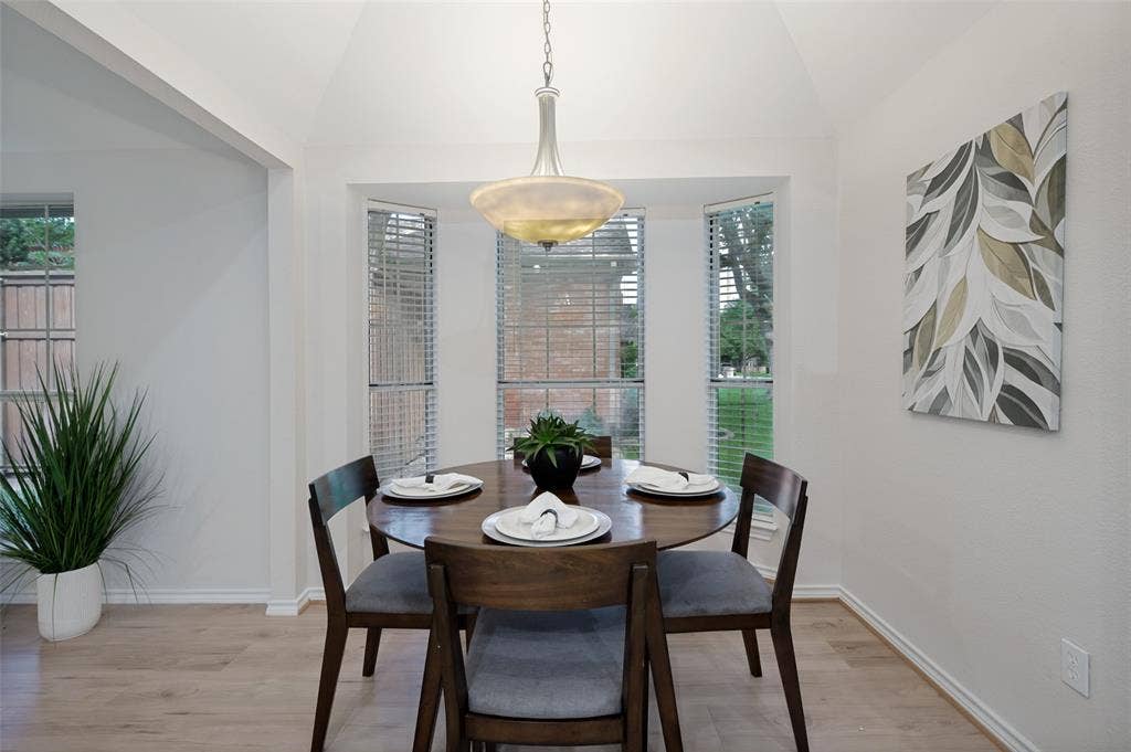 4420 Barwyn Lane, Plano, TX 75093 Dining area featuring a vaulted ceiling with a central pendant light fixture