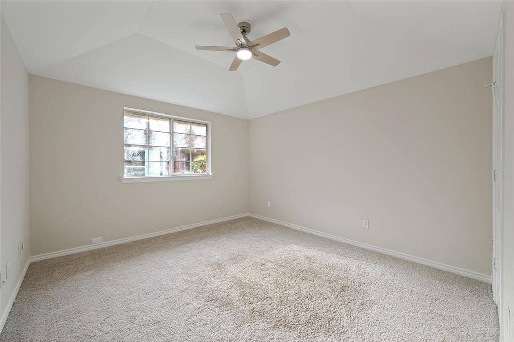 4420 Barwyn Lane, Plano, TX 75093 Spacious room featuring heightened ceilings, a contemporary ceiling fan with integrated lighting, neutral-toned walls, and plush carpeting