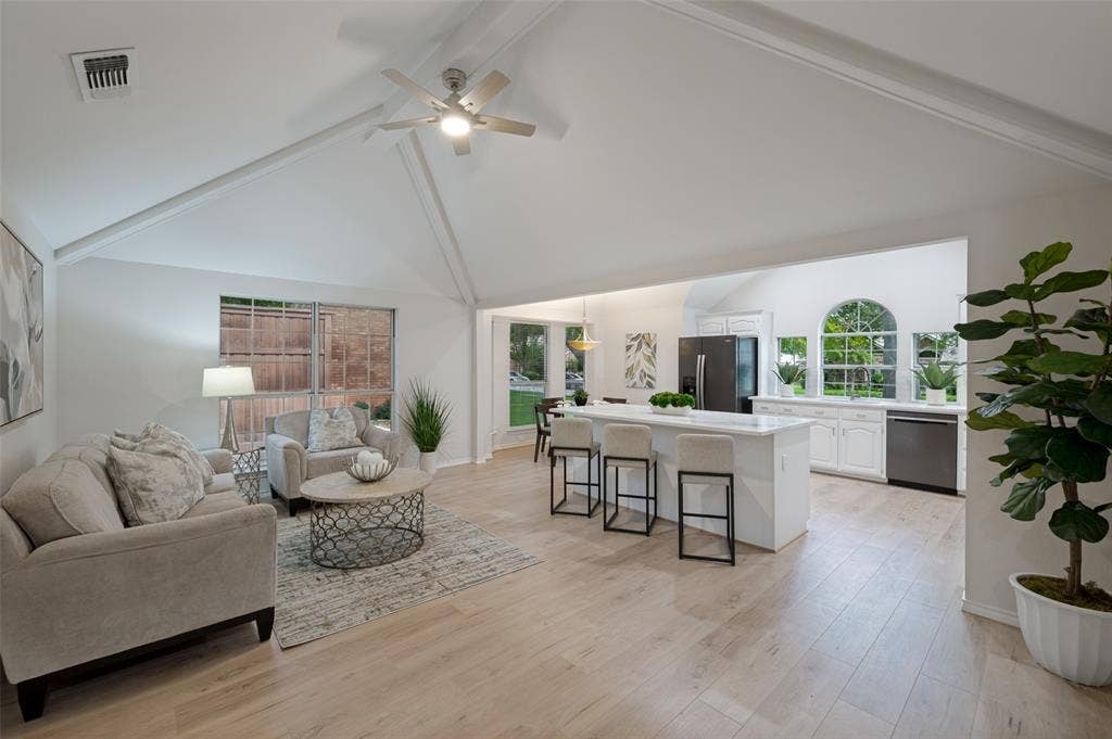 4420 Barwyn Lane, Plano, TX 75093 Expansive living area with vaulted ceilings and wood-finish flooring