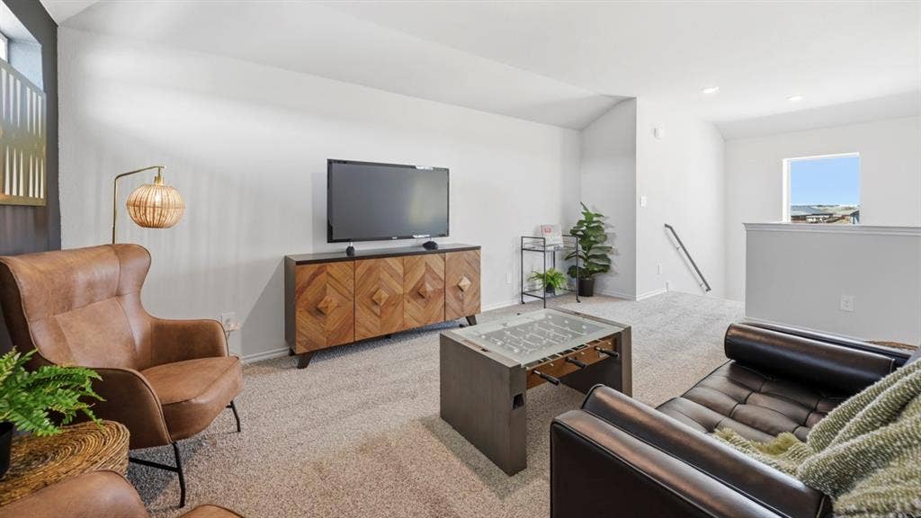 1957 Freeman Street, Tyler, TX 75704 Carpeted upper-level bonus room with a half-wall partition and a window