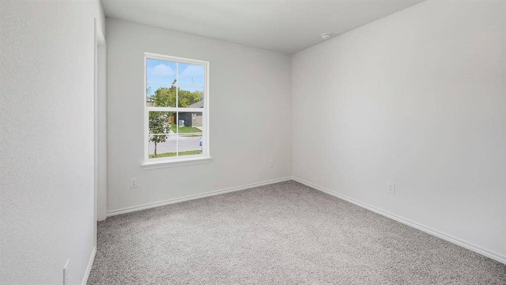 1961 Freeman Street, Tyler, TX 75702 Bright interior space with a window overlooking a streetscape with mature trees