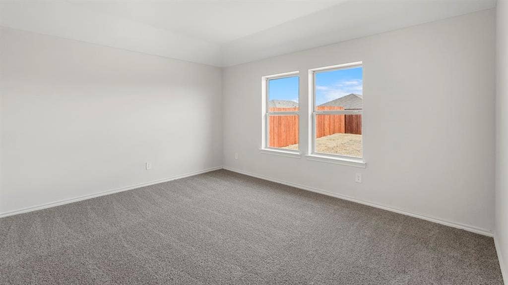 1969 Freeman Street, Tyler, TX 75702 Spacious room with gray carpet and white walls