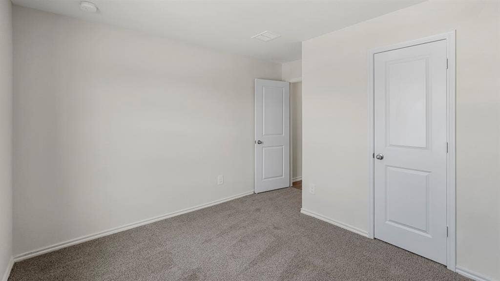 1969 Freeman Street, Tyler, TX 75702 Bedroom featuring light gray carpeting and white baseboards