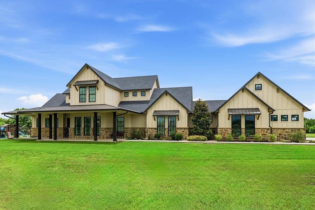 Expansive board and batten facade with stone detailing
