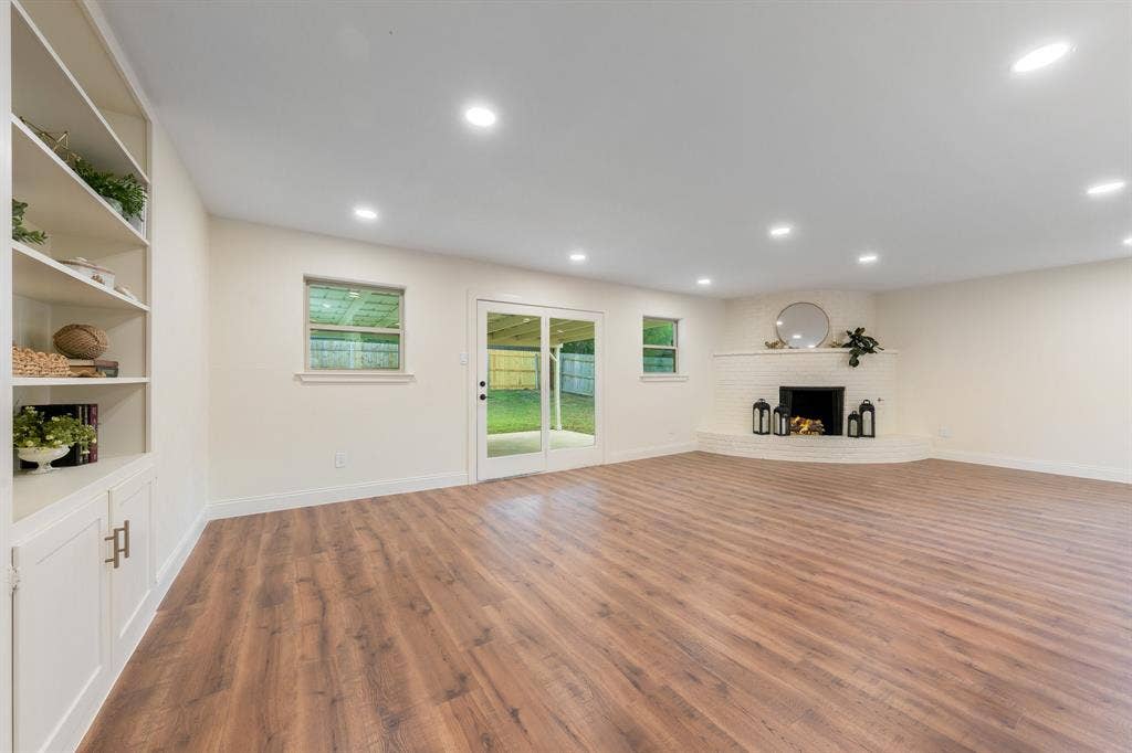 2212 Mountainview Drive, Hurst, TX 76054 Built-ins, fireplace with gas, new windows and lighting.