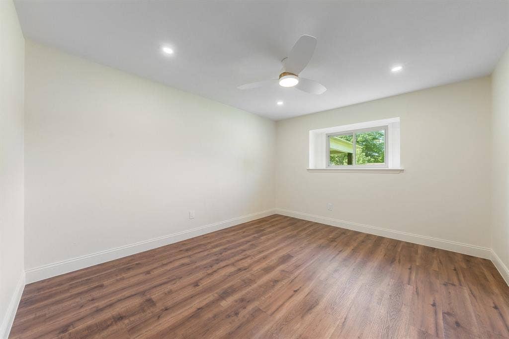 2212 Mountainview Drive, Hurst, TX 76054 New flooring, trim, windows and fan.