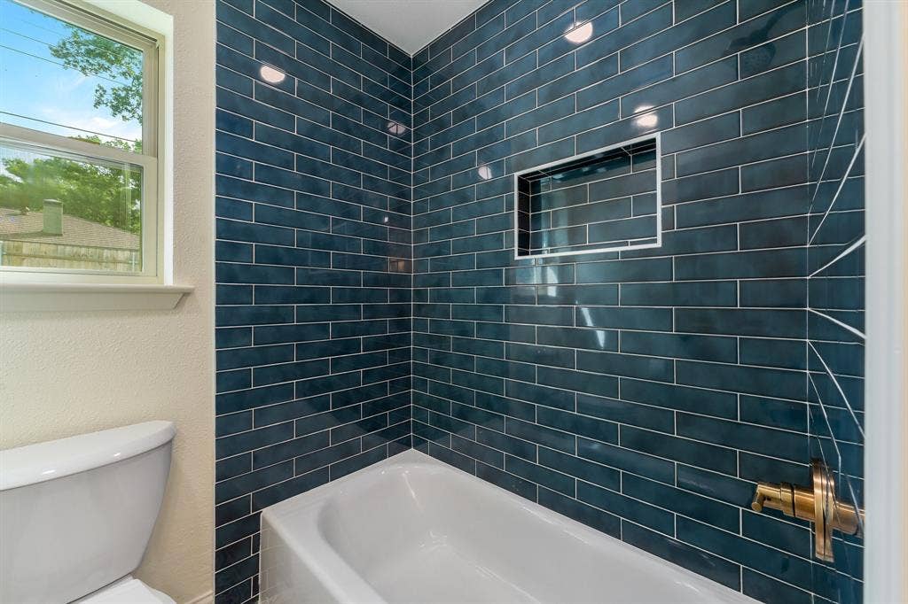 2212 Mountainview Drive, Hurst, TX 76054 New tile shower, tube and faucets.