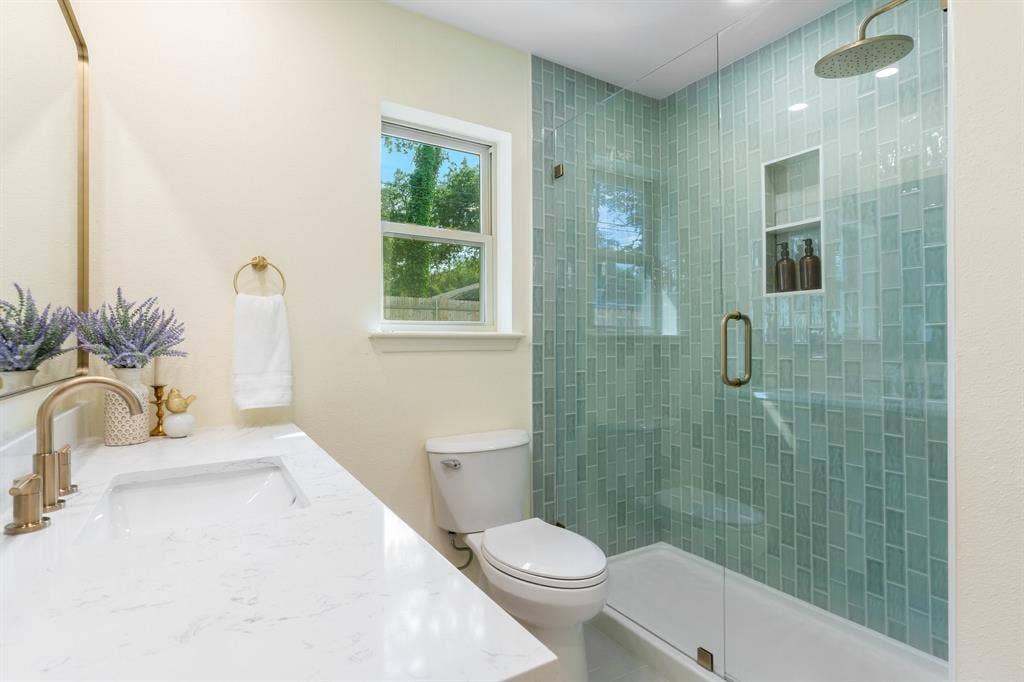 2212 Mountainview Drive, Hurst, TX 76054 New tile, glass and shower head.