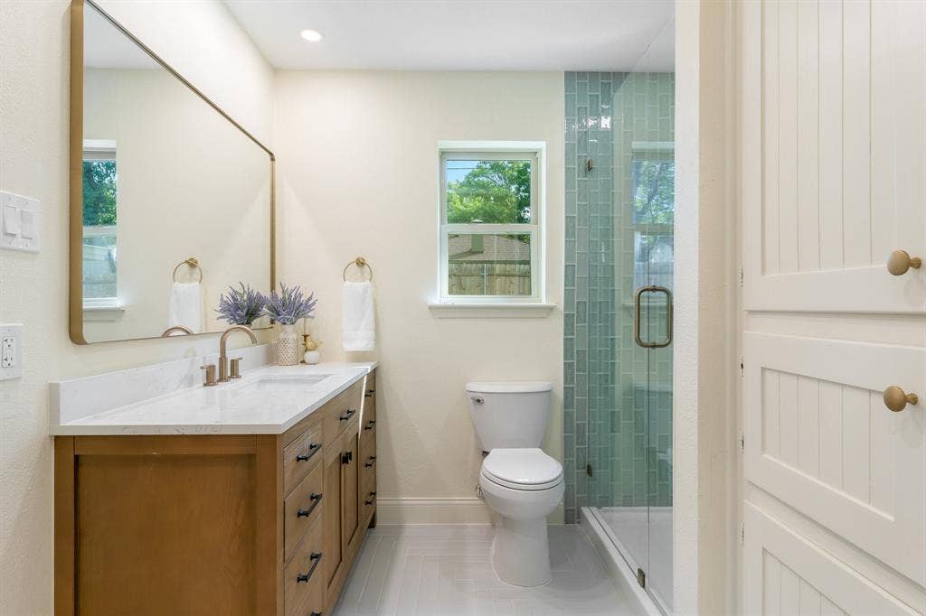 2212 Mountainview Drive, Hurst, TX 76054 New tile flooring, vanity, faucet, miror and lighting.