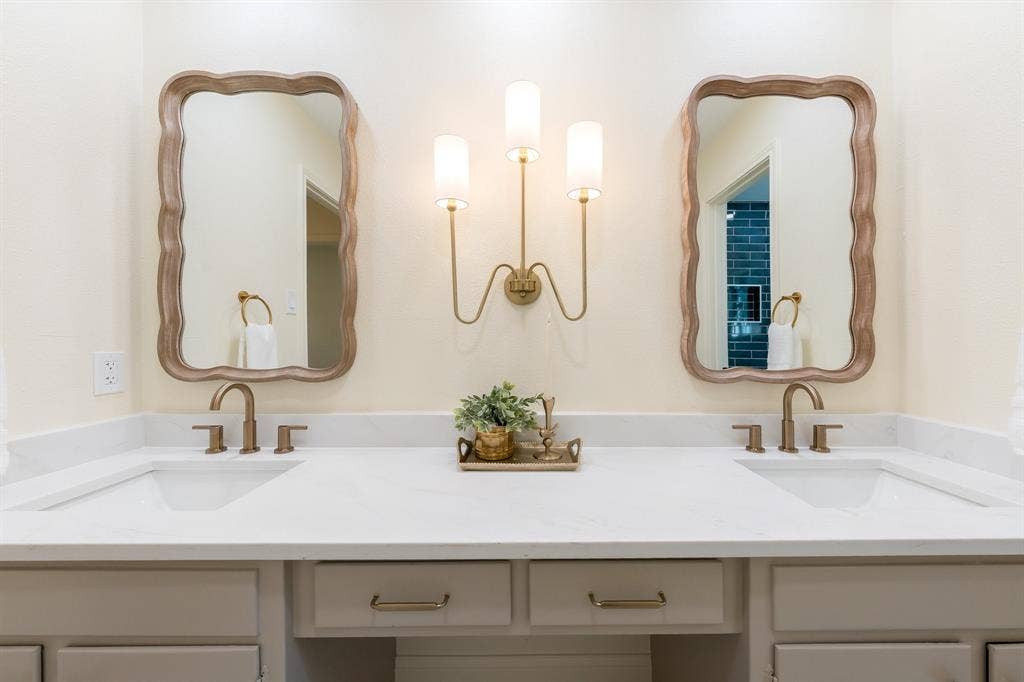 2212 Mountainview Drive, Hurst, TX 76054 New quartz, faucets, mirrors and lighting.