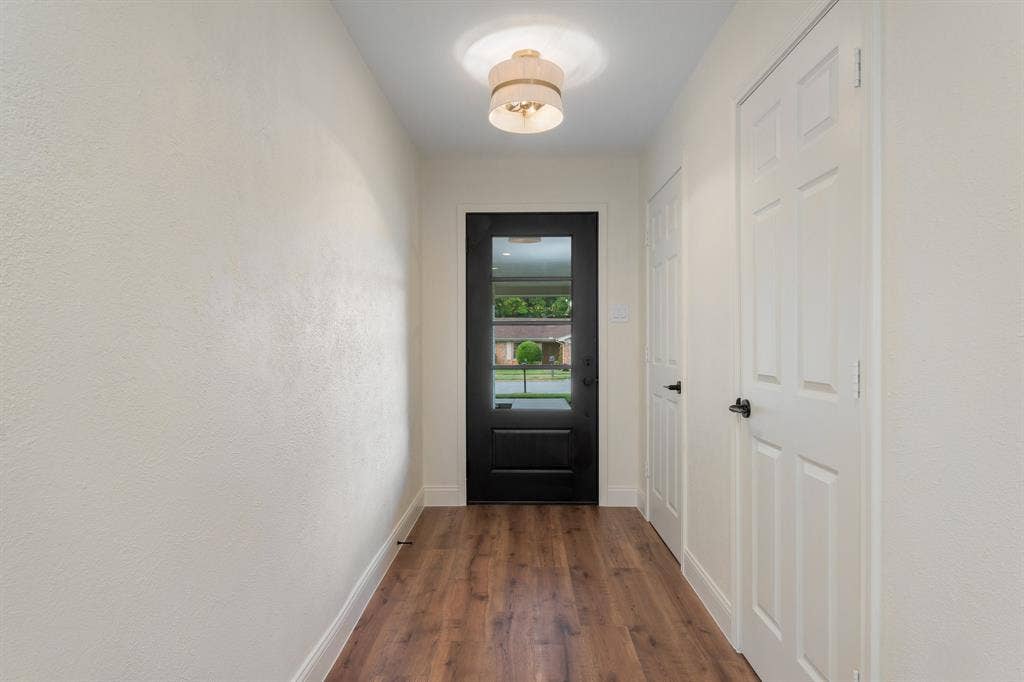 2212 Mountainview Drive, Hurst, TX 76054 New flooring, light fixtures, doors and trim.