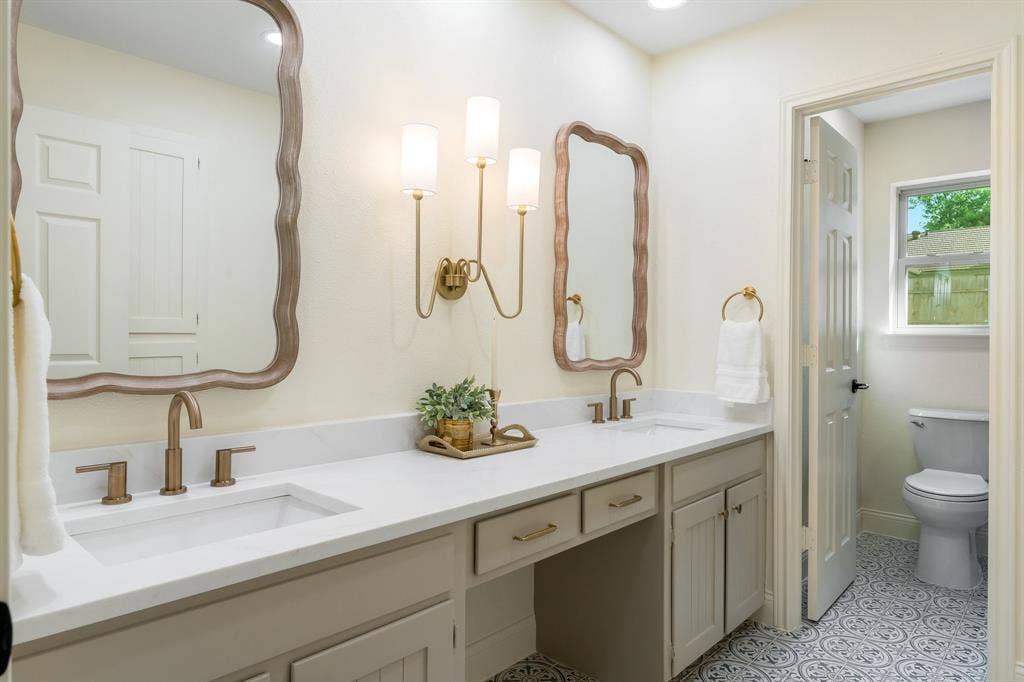 2212 Mountainview Drive, Hurst, TX 76054 New floor tile, new toilet and freshly painted vanity.