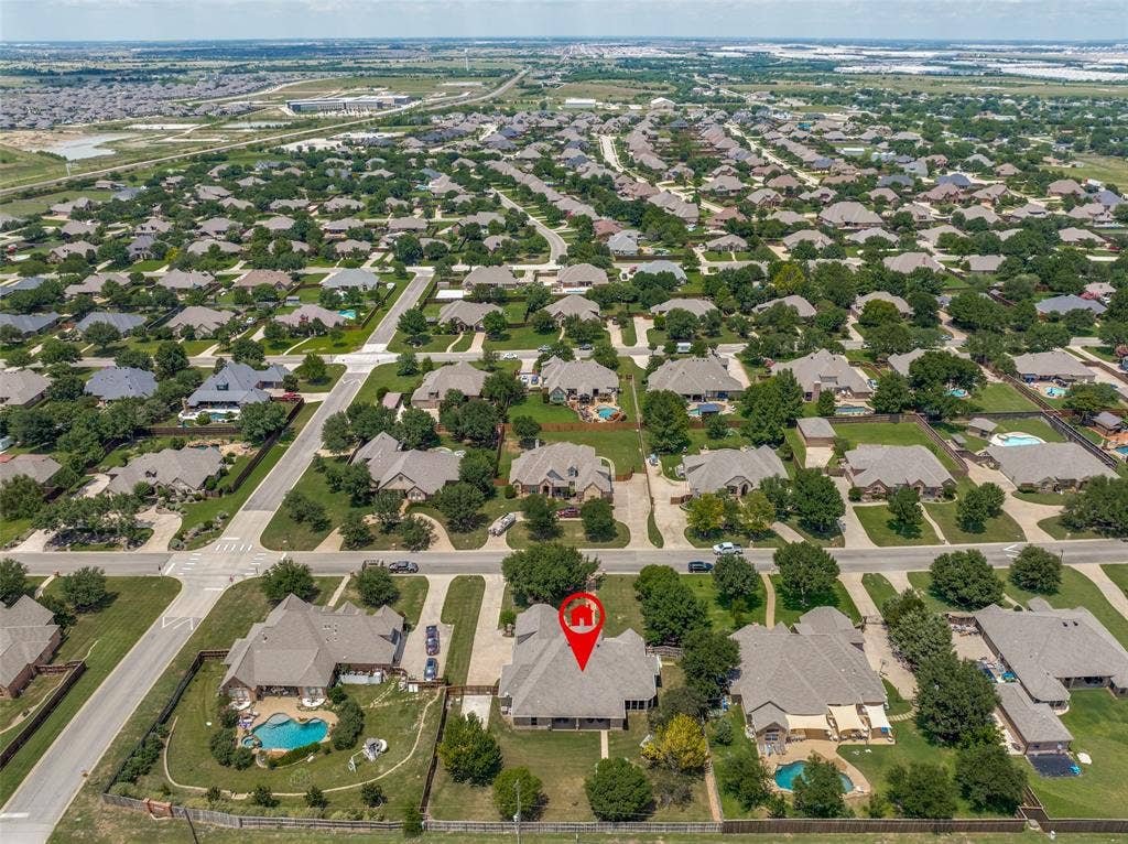 Aerial perspective of a residential neighborhood featuring established homes with varied architectural styles