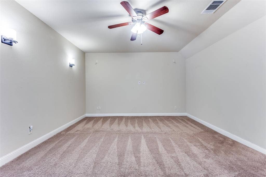 817 Deer Ridge Trail, McKinney, TX 75072 Media room with surround sound and celing fan