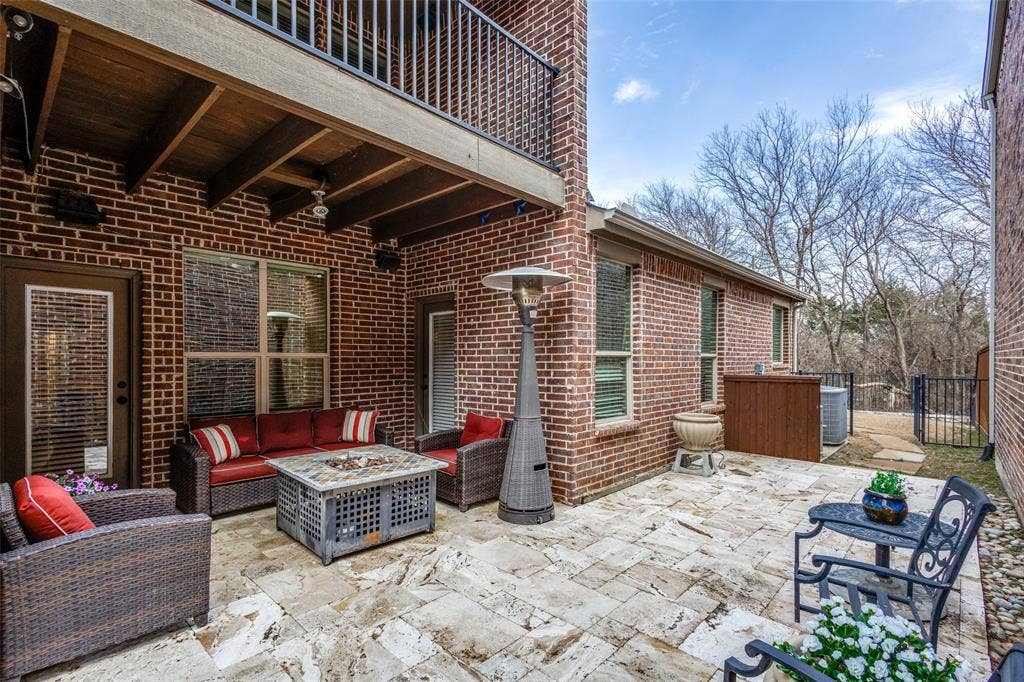 817 Deer Ridge Trail, McKinney, TX 75072 covered patio with Riveria Travertine patio