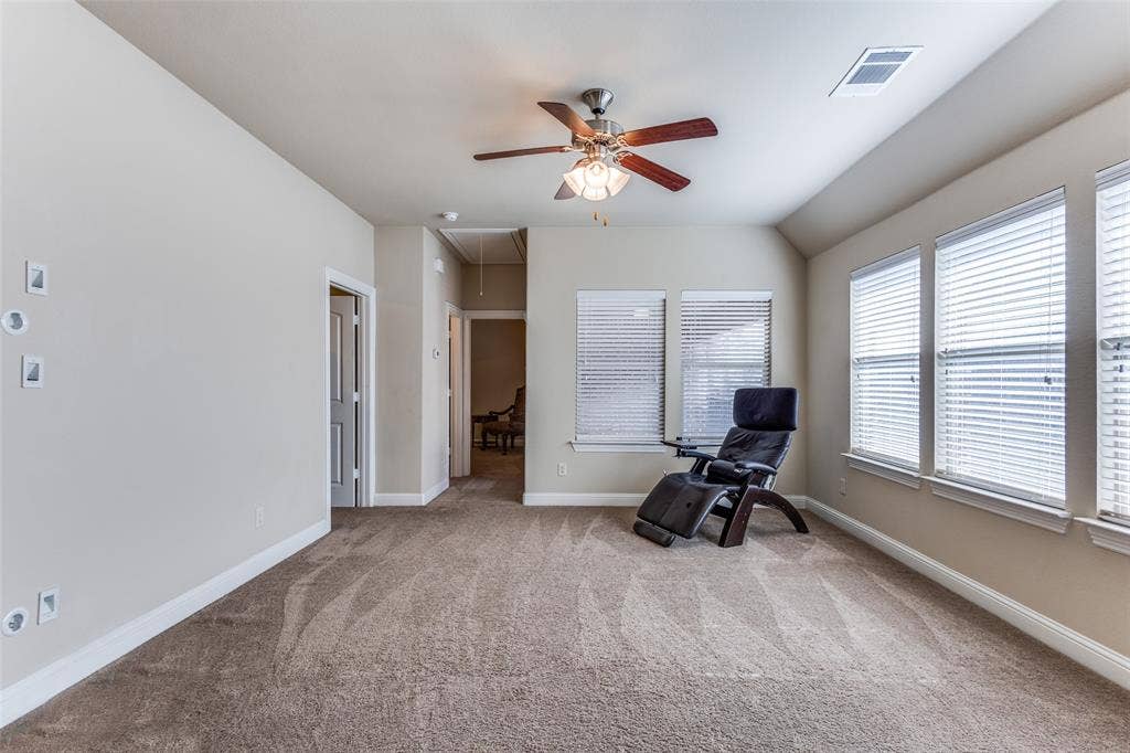 817 Deer Ridge Trail, McKinney, TX 75072 2nd floor game room with wall of windows and ceiling fan