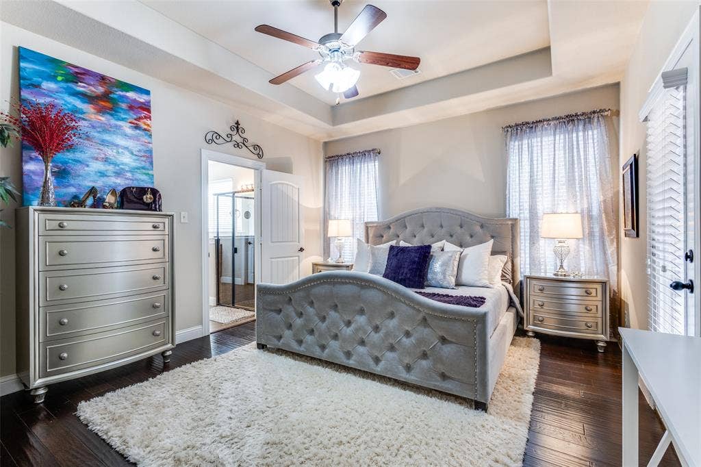 817 Deer Ridge Trail, McKinney, TX 75072 Master bedroom with door to side patio, wood flooring and ceiling fan