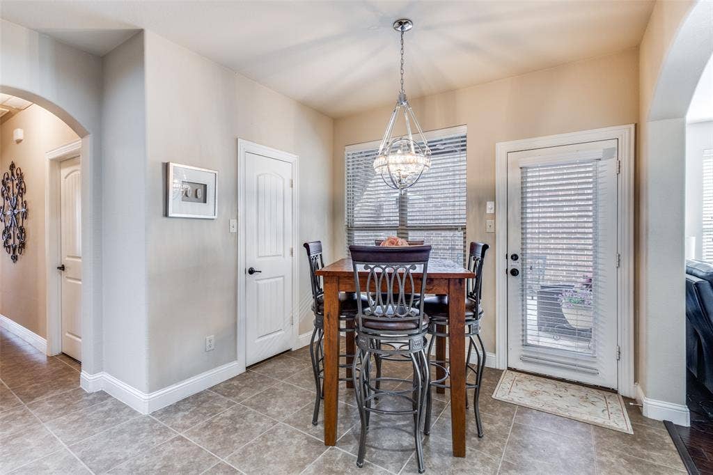 817 Deer Ridge Trail, McKinney, TX 75072 Eating area with pantry and door to side patio