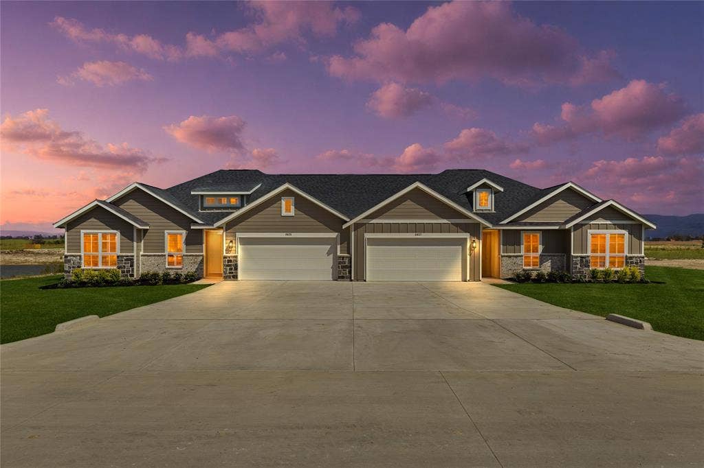 6600-6602 Florence Drive, Midlothian, TX 76065 Duplex property featuring a dark gray shingle roof, light brown siding, and stone veneer accents