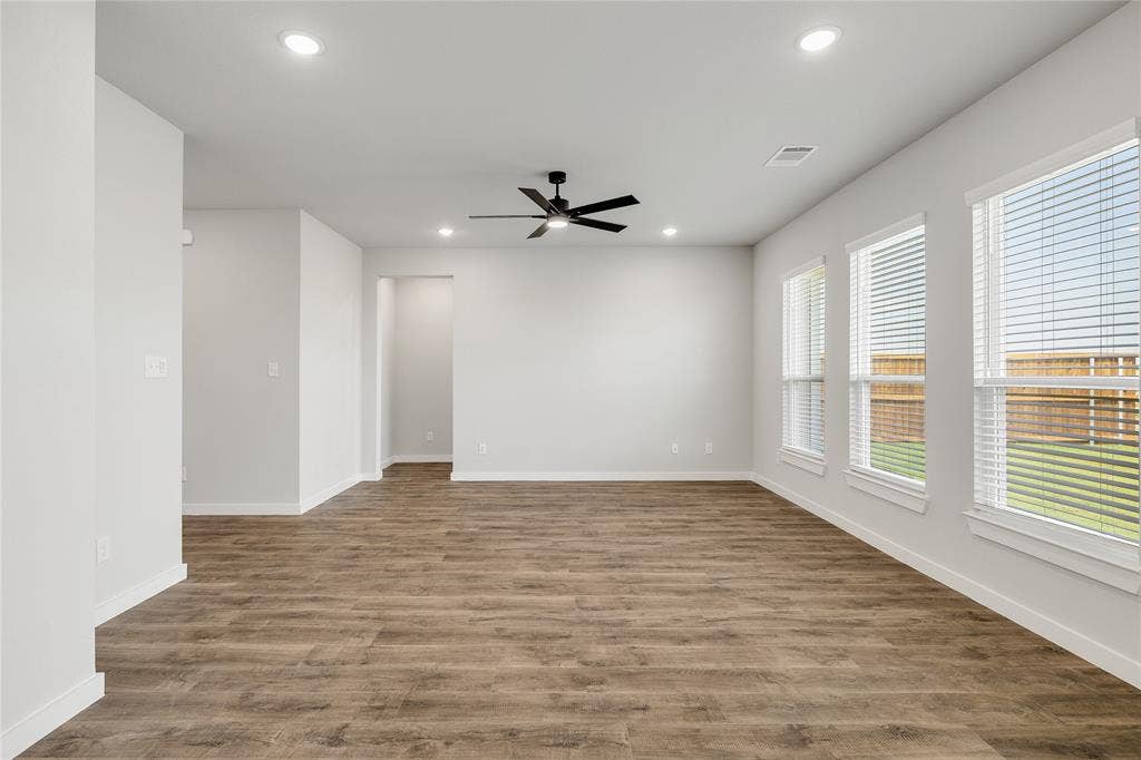 6600-6602 Florence Drive, Midlothian, TX 76065 Spacious interior featuring wood-finish flooring, recessed lighting, and a contemporary ceiling fan