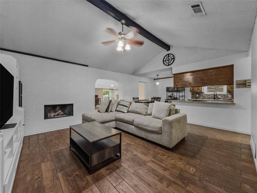6412 Storm Drive, Watauga, TX 76148 Spacious main living room featuring brick fireplace