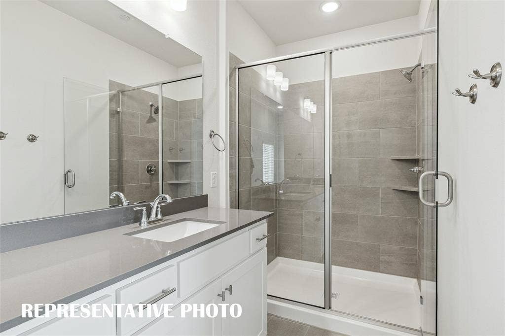3725 Pierce Lane, Grand Prairie, TX 75052 The spacious walk in shower is the perfect place to start or end your day! REPRESENTATIVE PHOTO