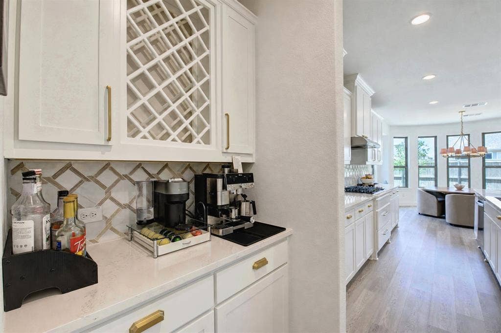 304 Cottontail Lane, Northlake, TX 76247 A butler's pantry, which makes an excellent coffee bar, connects the dining room and kitchen.