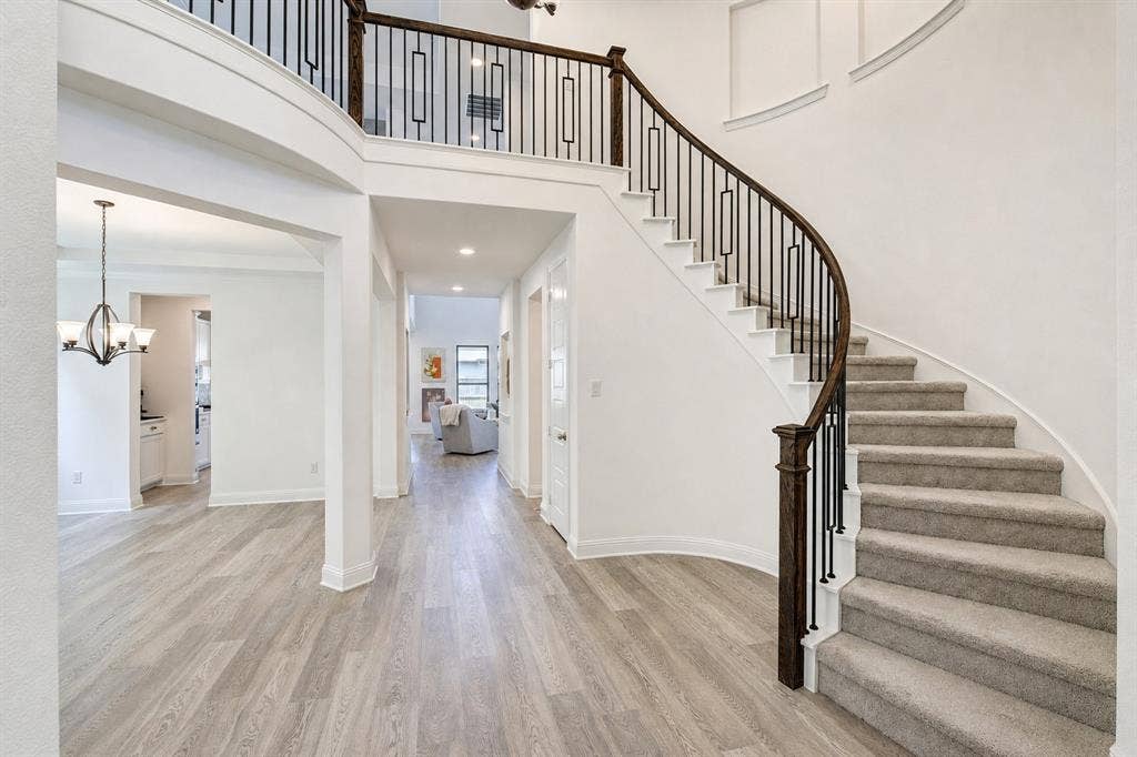 304 Cottontail Lane, Northlake, TX 76247 A dramatic two-story entry with a curved staircase welcomes you inside.
