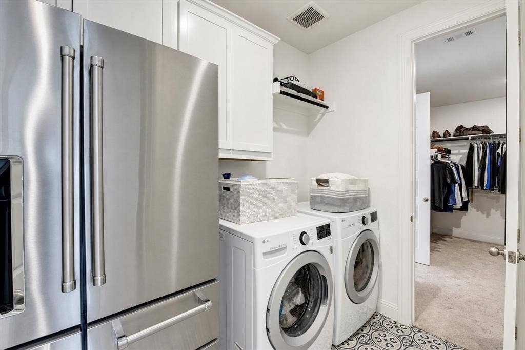 304 Cottontail Lane, Northlake, TX 76247 The laundry room, with space for a second fridge, conveniently connects to the walk-in closet in the primary bedroom.