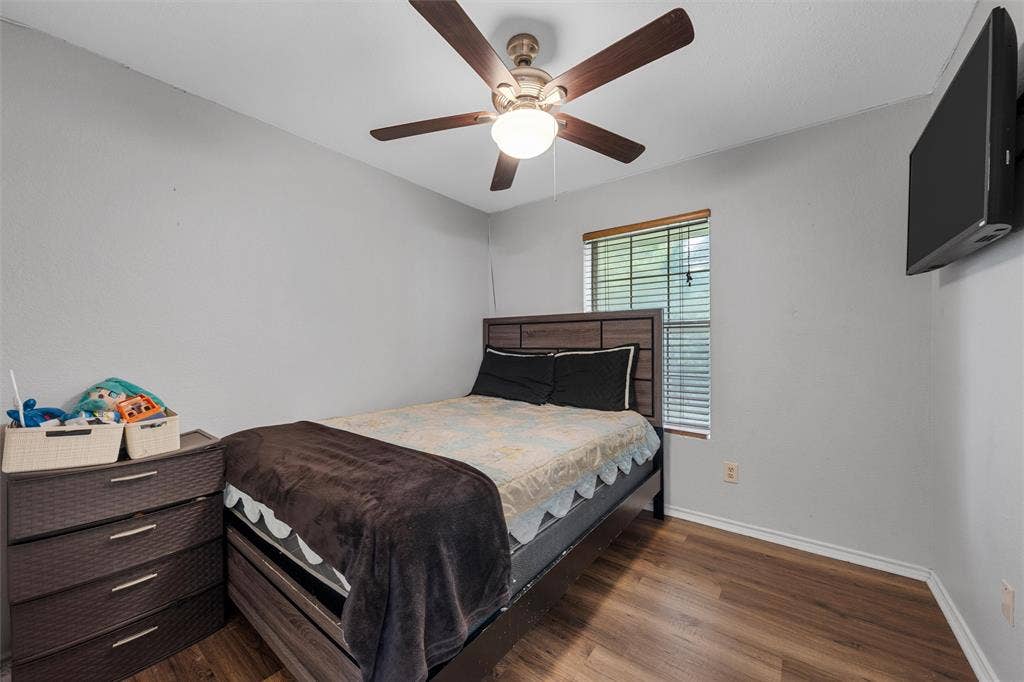 1307 Luanne, Bellmead, TX 76705 Bright room featuring wood-finish flooring and light gray walls