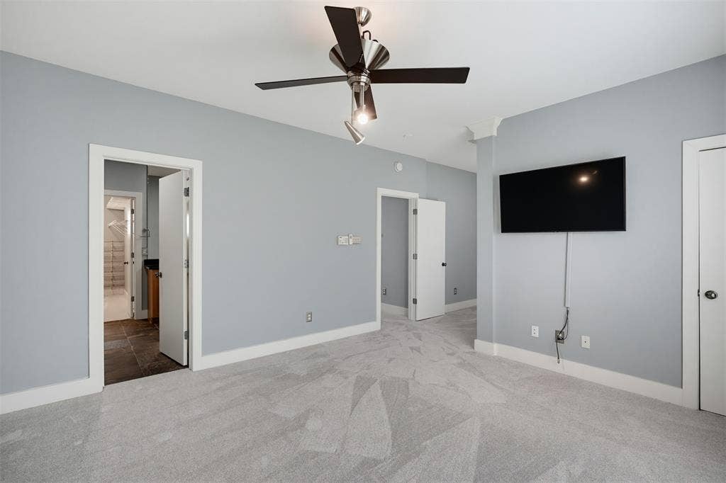 4830 Cedar Springs Road, #30, Dallas, TX 75219 Light-colored carpeting with a contemporary ceiling fan and recessed lighting