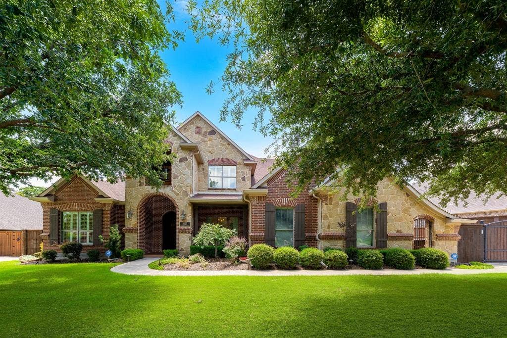 Beautiful Brick and stone exterior with meticulous landscaping.