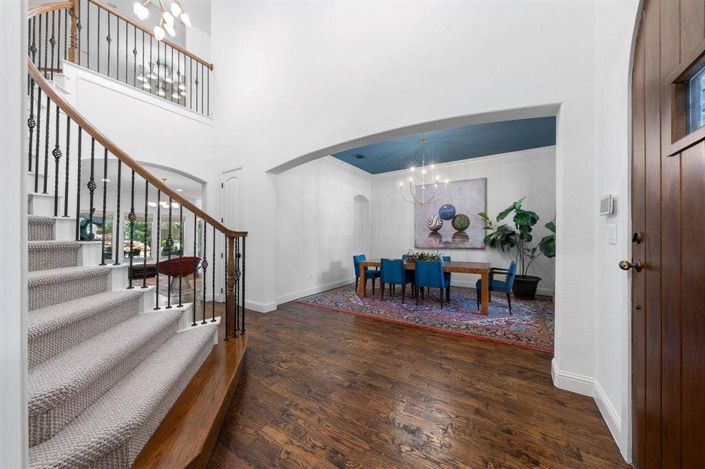 Grand entrance with spiral staircase and nail down hardwood floors throughout.