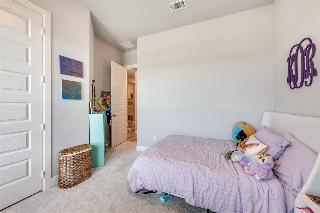 2703 Trinity Ridge Street, Mansfield, TX 76063 Light-colored carpeting complementing neutral wall tones