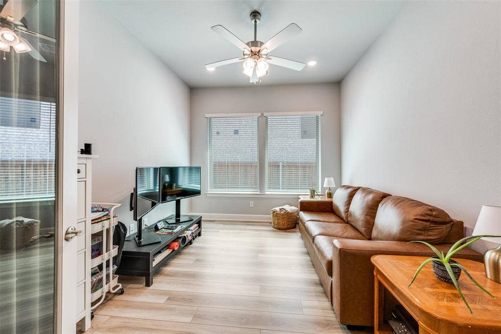 2703 Trinity Ridge Street, Mansfield, TX 76063 Living area featuring vaulted ceilings, wood-finish flooring, and recessed lighting