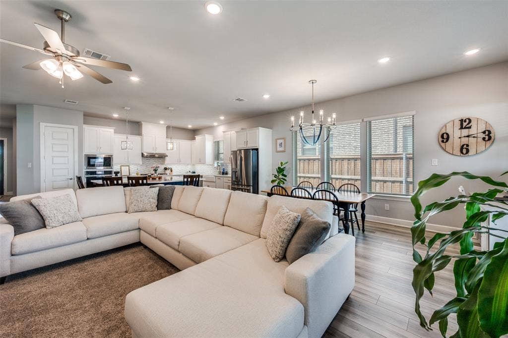 2703 Trinity Ridge Street, Mansfield, TX 76063 Spacious living area featuring light wood-finish flooring, recessed lighting, and a ceiling fan