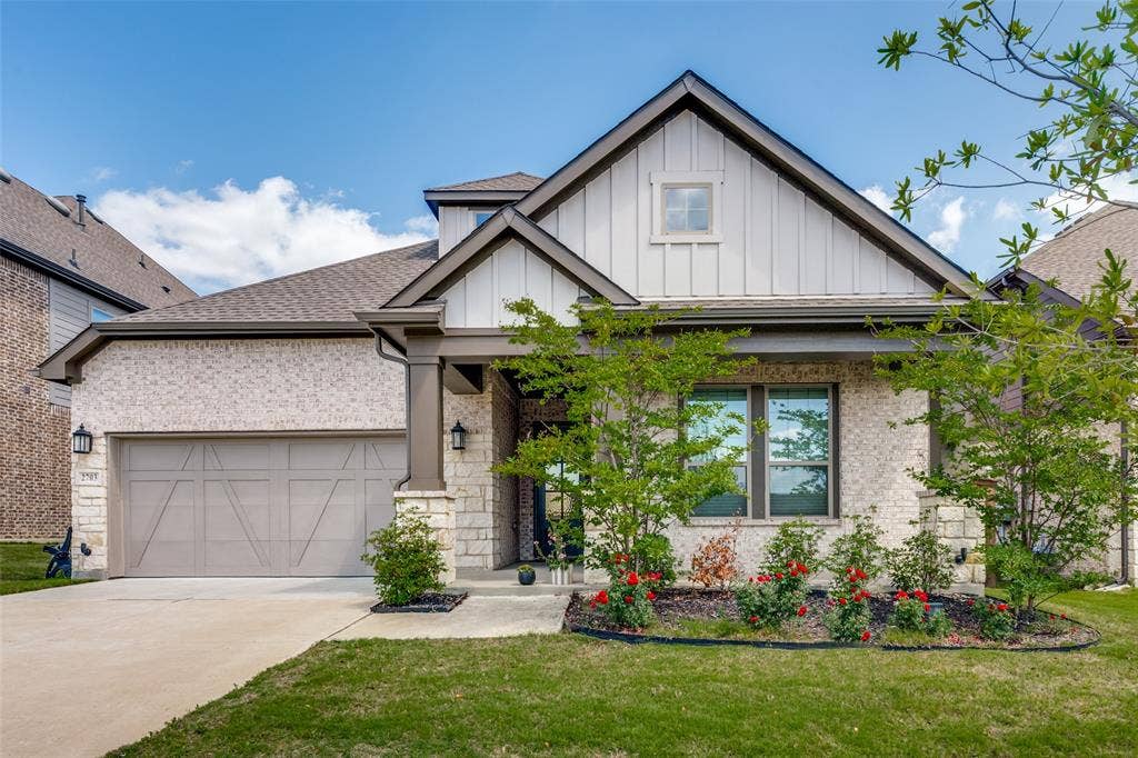 2703 Trinity Ridge Street, Mansfield, TX 76063 Contemporary single-family residence featuring a light brick and stone facade