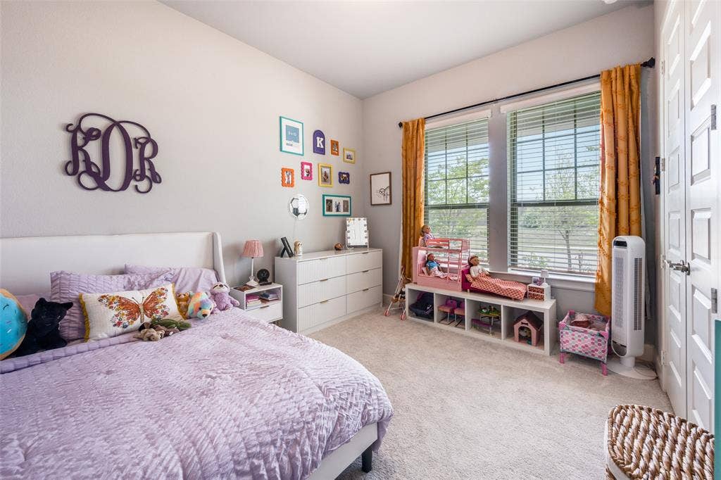 2703 Trinity Ridge Street, Mansfield, TX 76063 Bedroom featuring light gray walls, carpet flooring, and two large windows with blinds and curtain rods