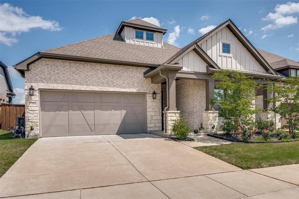 2703 Trinity Ridge Street, Mansfield, TX 76063 Stone and brick exterior with a two-car garage