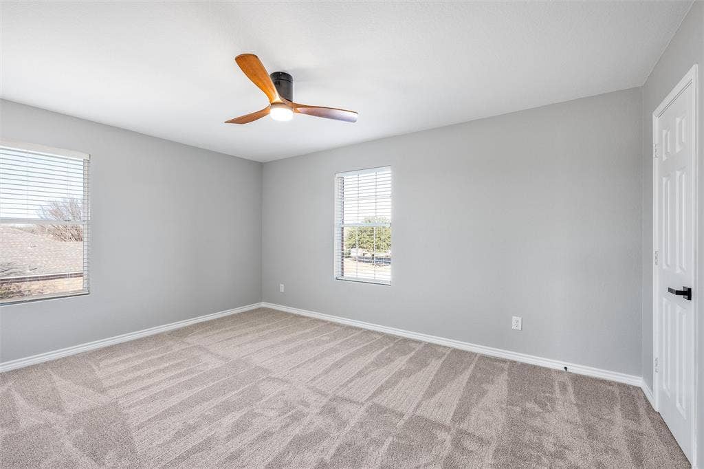 1123 Caroline Drive, Princeton, TX 75407 Upstairs Bedroom #2 with walk in closet, new carpet and ceiling fan