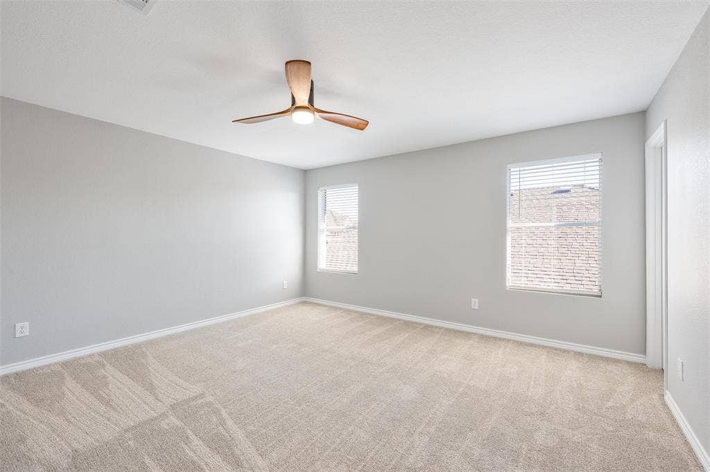 1123 Caroline Drive, Princeton, TX 75407 Upstairs bedroom #3 with walk in closet, new carpet and ceiling fan