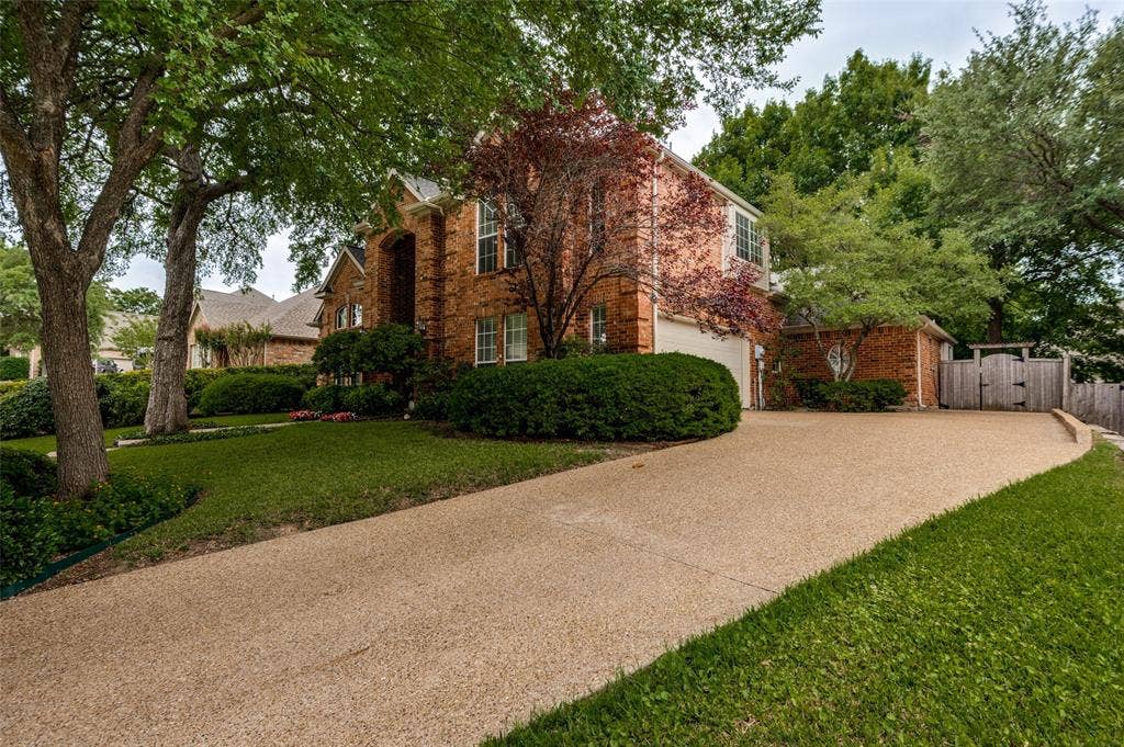 2820 Creek Bend, McKinney, TX 75072 The driveway and walkway to the home was recently replaced along with the back patio.