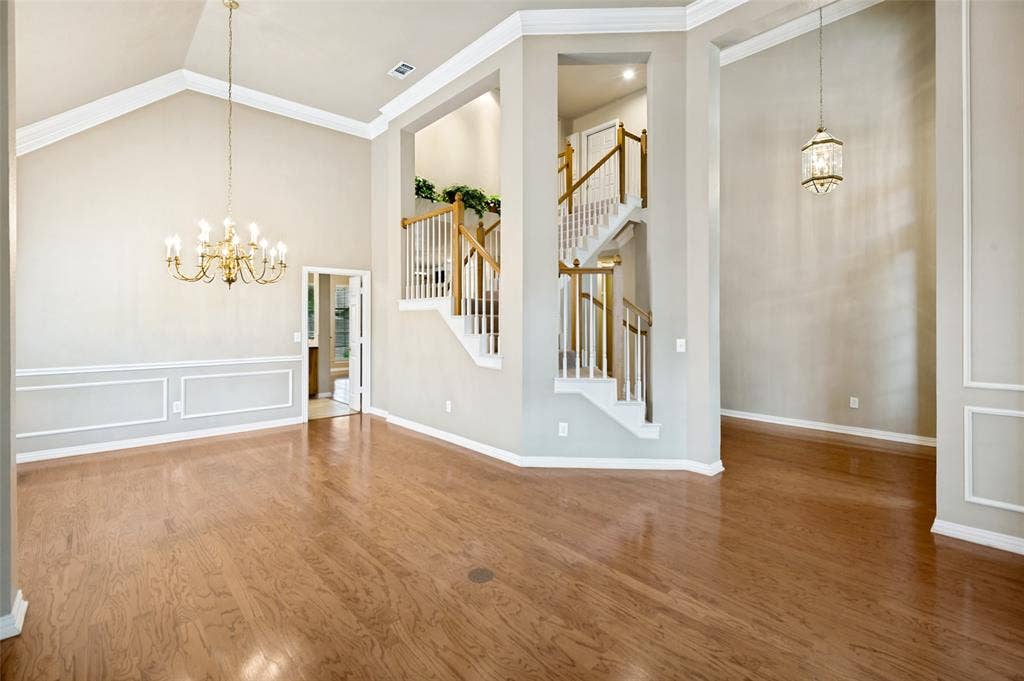 2820 Creek Bend, McKinney, TX 75072 The expansive entry opens to the living and dining rooms with hardwood flooring and attention to designer details.